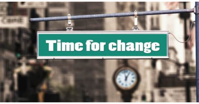 A green sign displaying the message "Time for Change" against a neutral background, symbolizing transformation and progress.